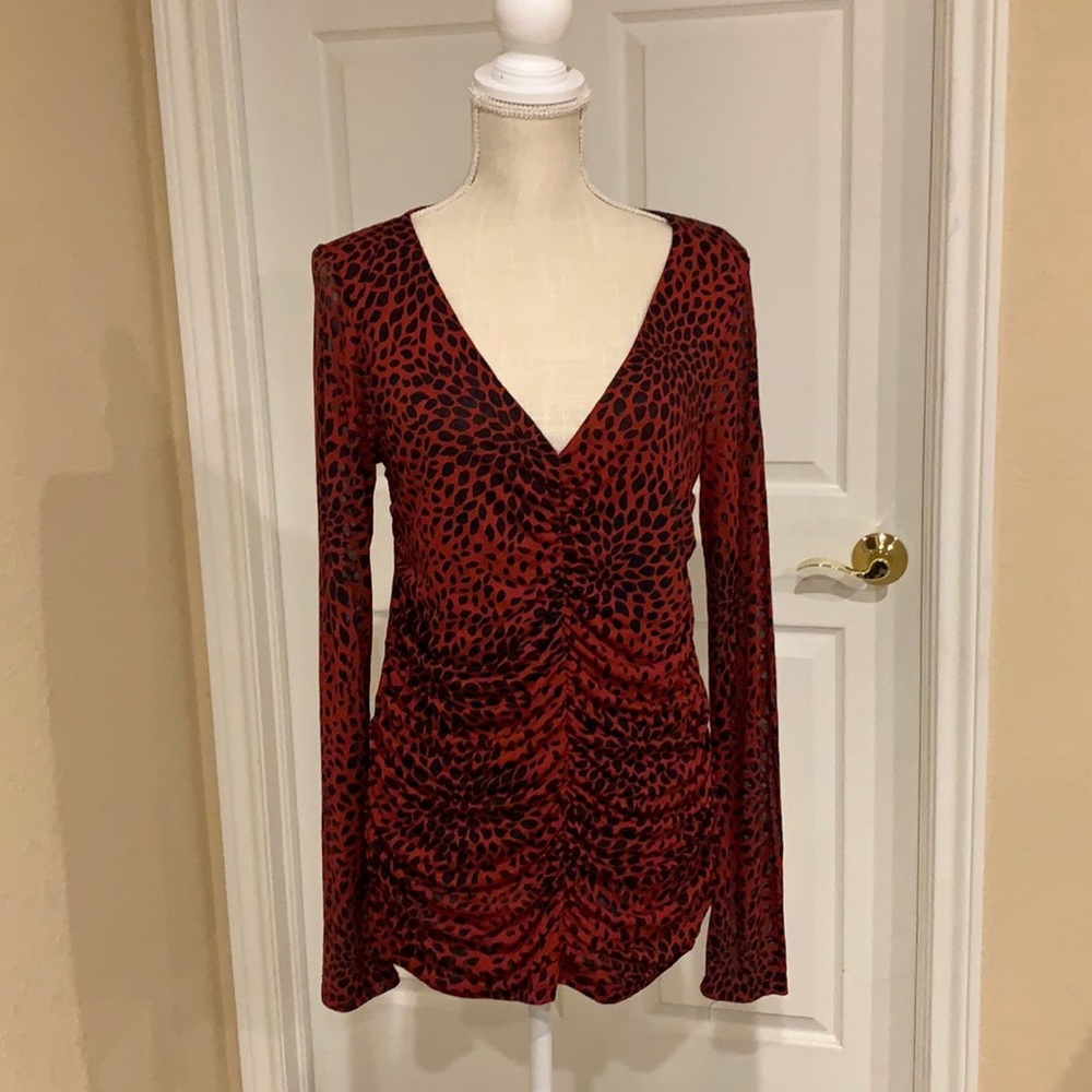 INC long sleeve, red and black animal print top. Gathered  down the front